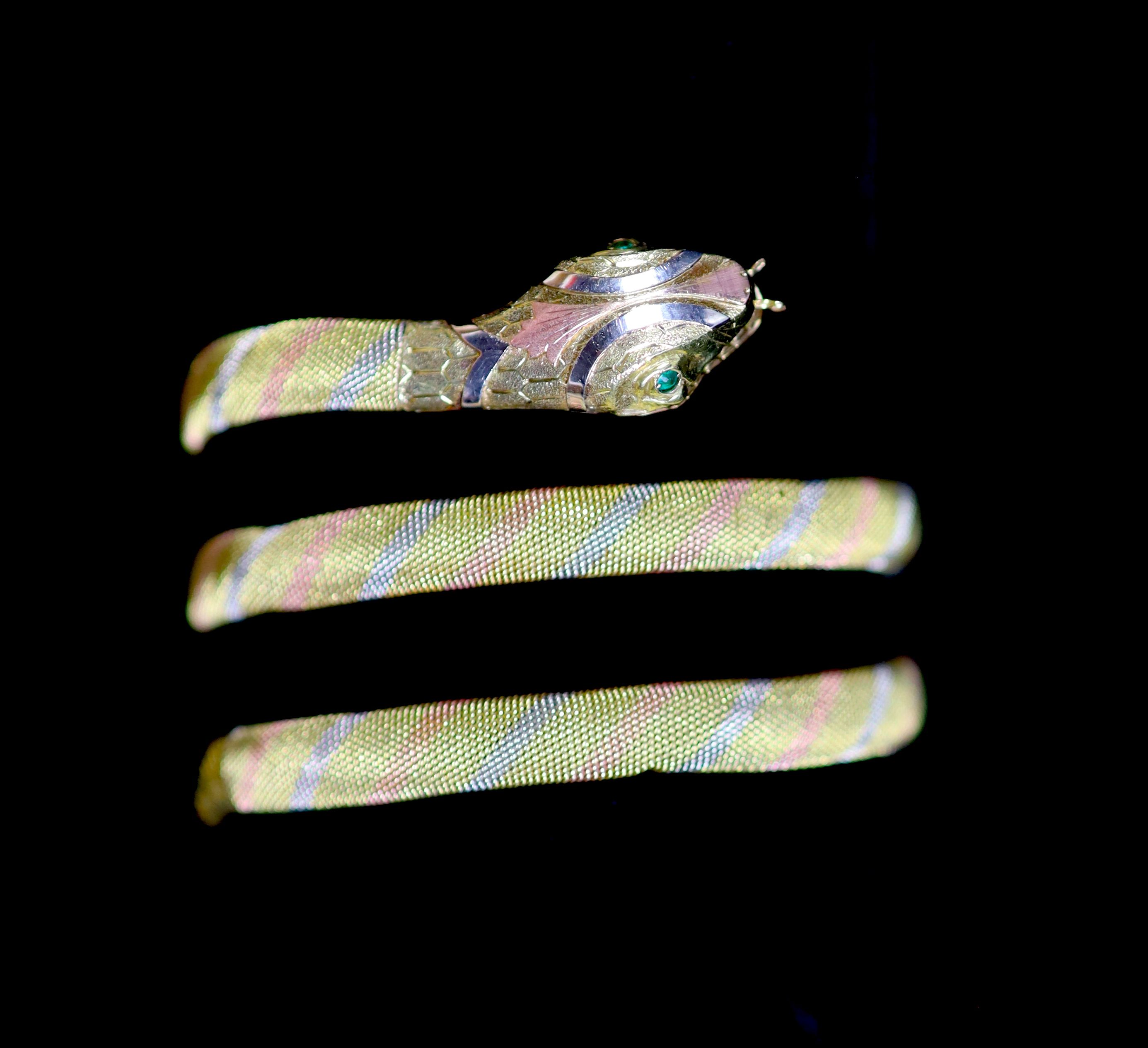 A mid to late 20th century three colour 18ct gold serpent bangle